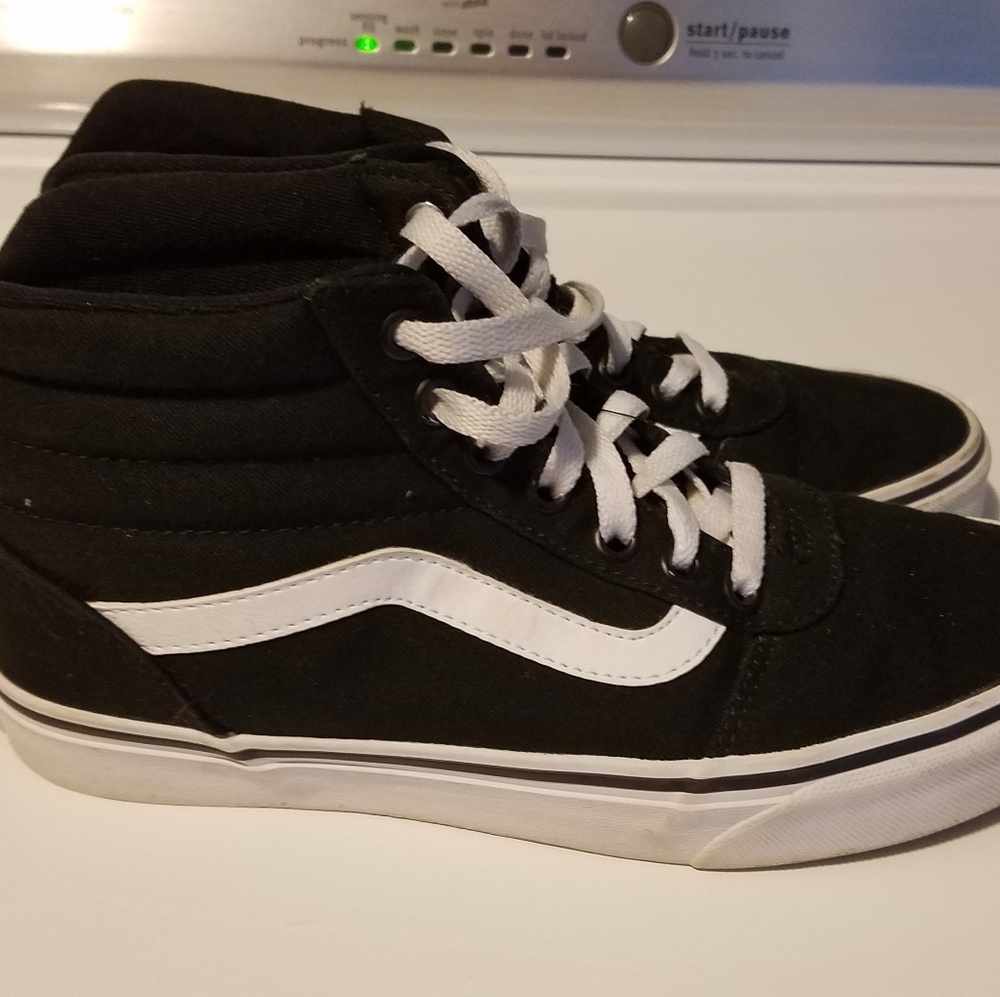 Black and white high top vans
